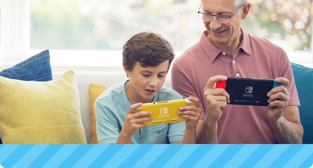 Picture of grandson and grandpa on a couch playing Nintendo Switch and Nintendo Switch Lite together.